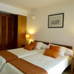 Villa Tropic 2 bedroom bed with decorative cushions