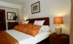 Villa Tropic 2 bedroom bed with decorative cushions