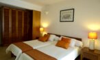 Villa Tropic 2 bedroom bed with decorative cushions